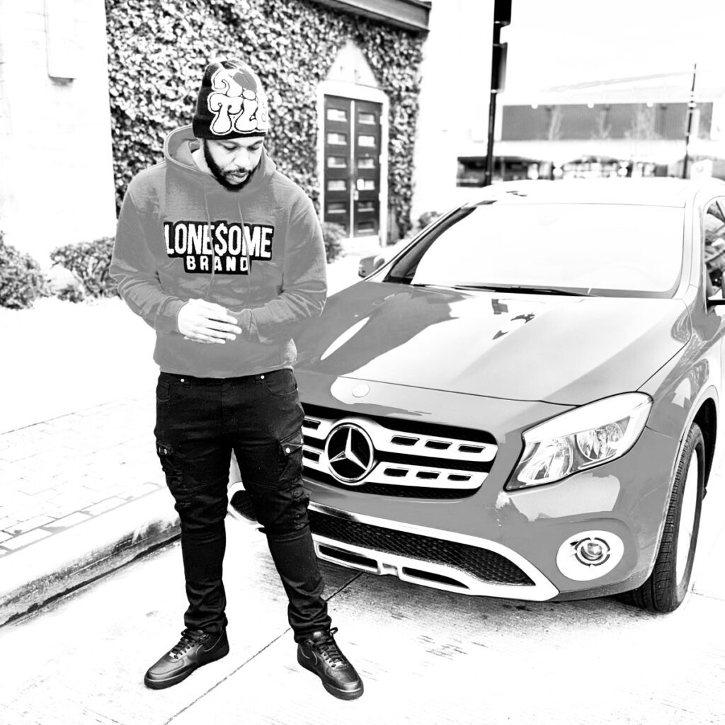 A man standing in front of a Mercedes.