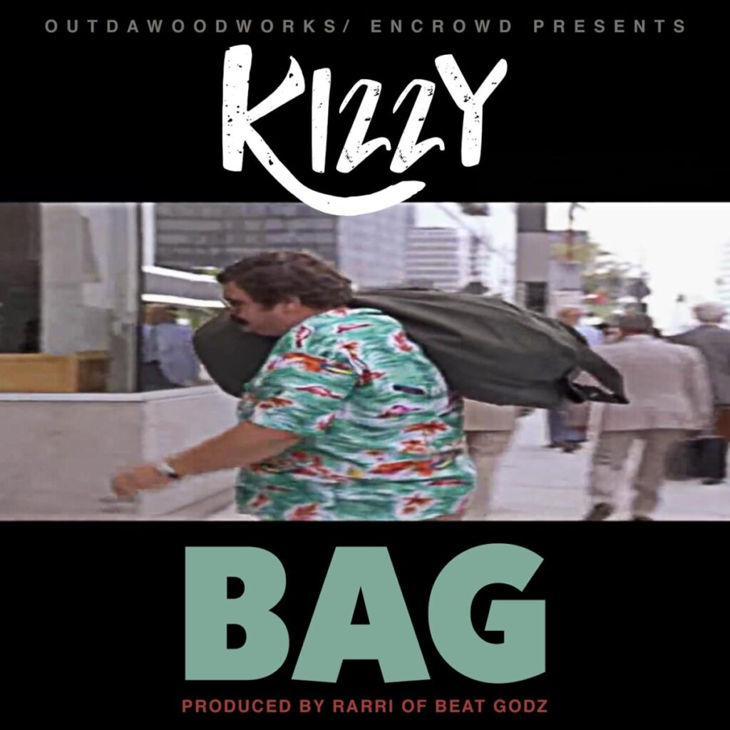 Kizzy carrying a bag over his shoulder.