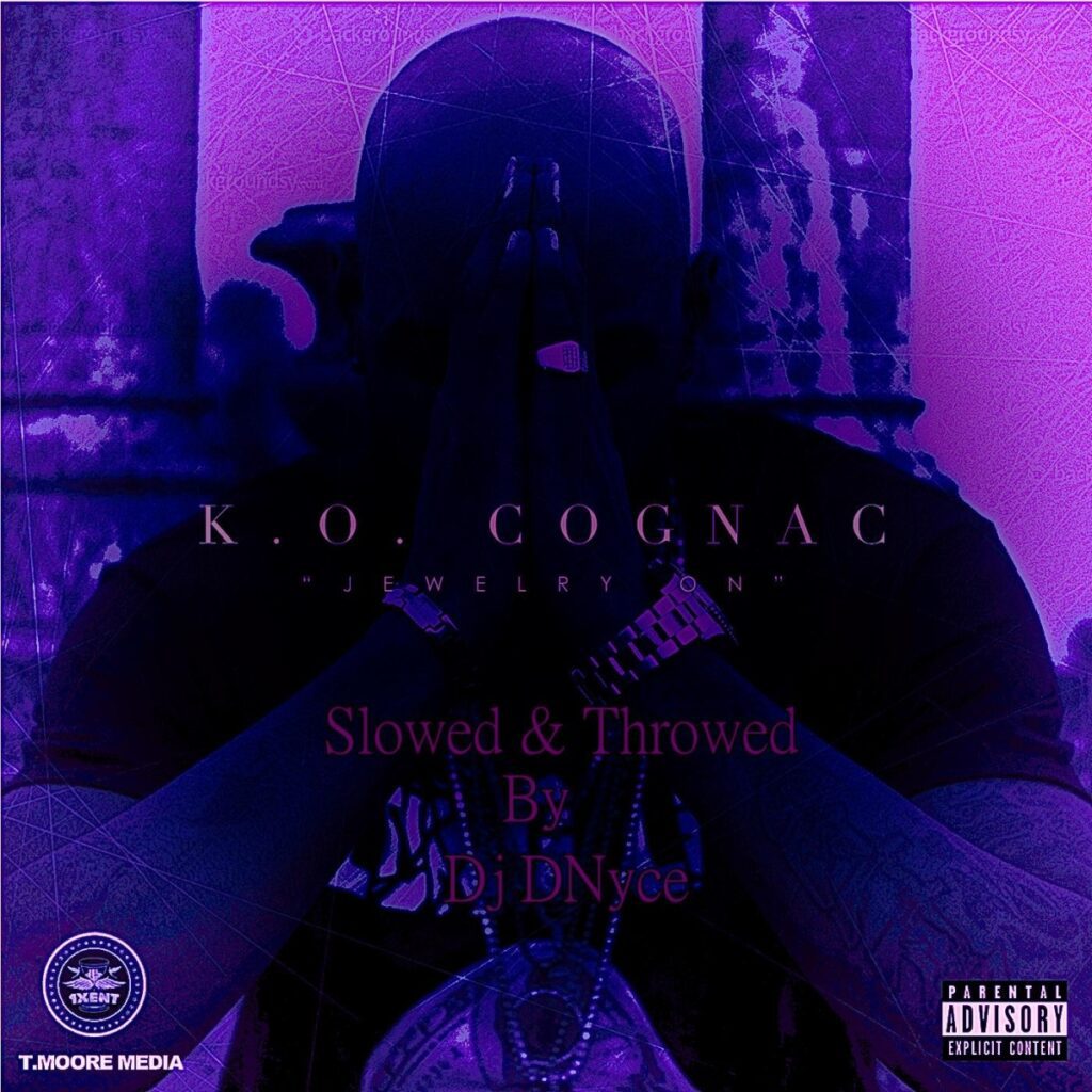K.O. Cognac in purple praying pose with album title.