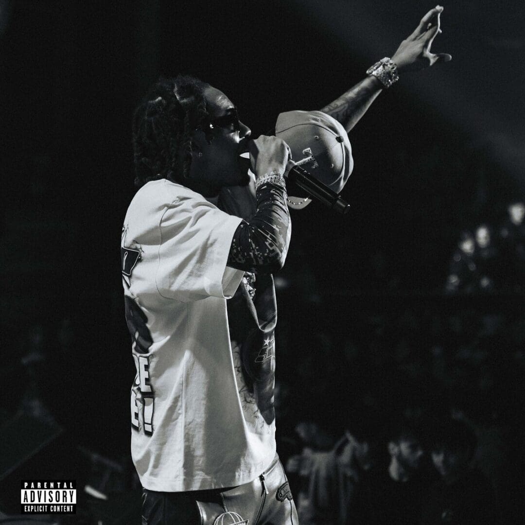Here's an 8-word alt tag for the image: Black and white photo of Lil Durk performing.