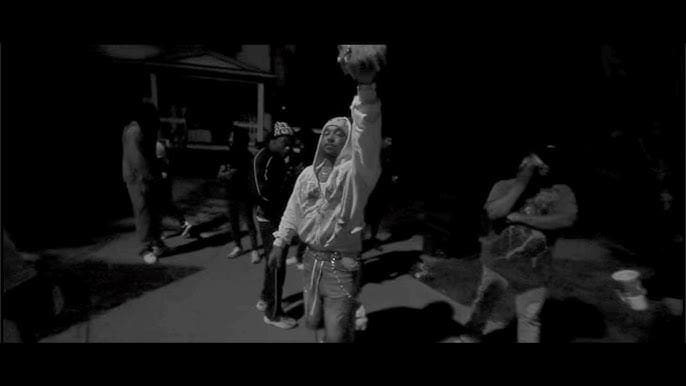 Group of people standing outside at night.
