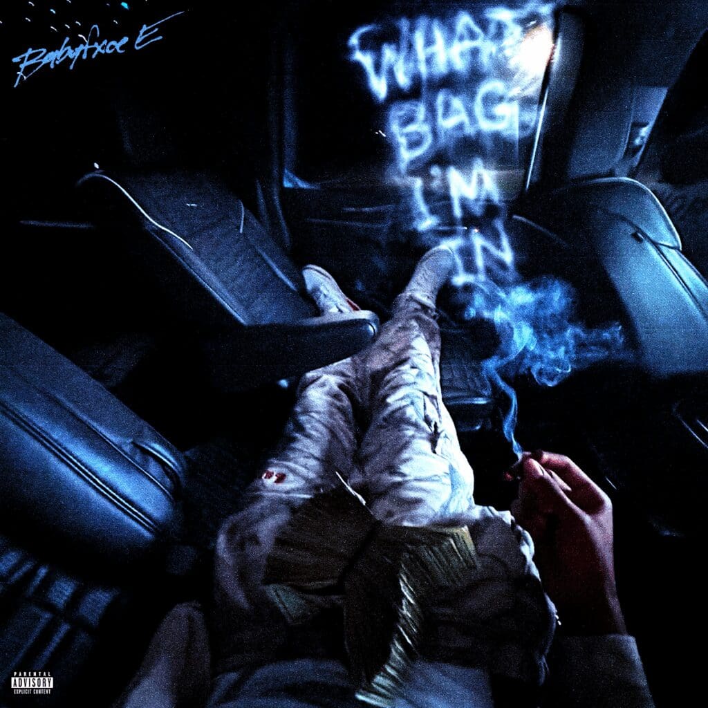 Person in car with smoke and text.