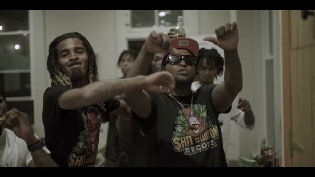 Group of people dancing and celebrating indoors.